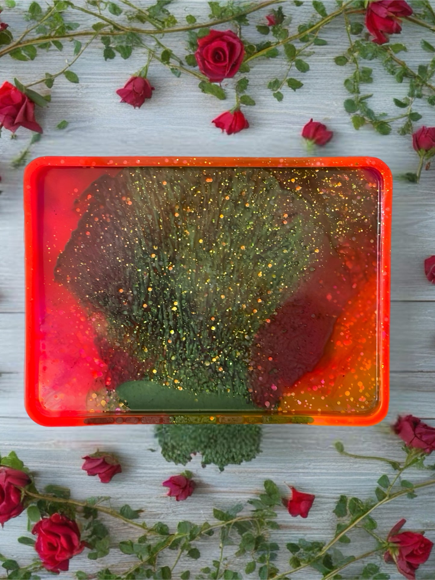 Neon pink and orange resin tray with metallic green swirl