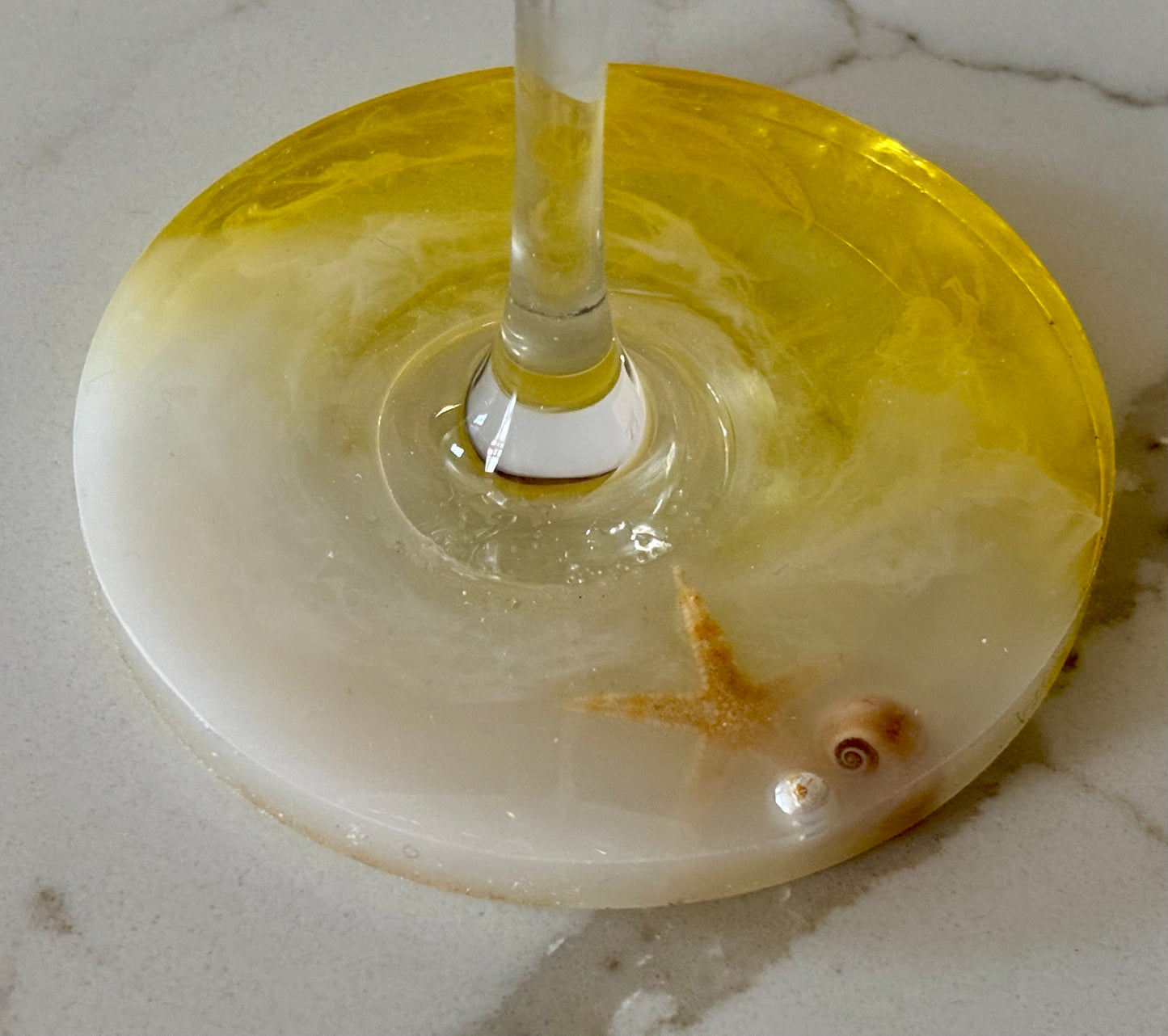 Hand-poured base with embedded shell, pearl, and starfish