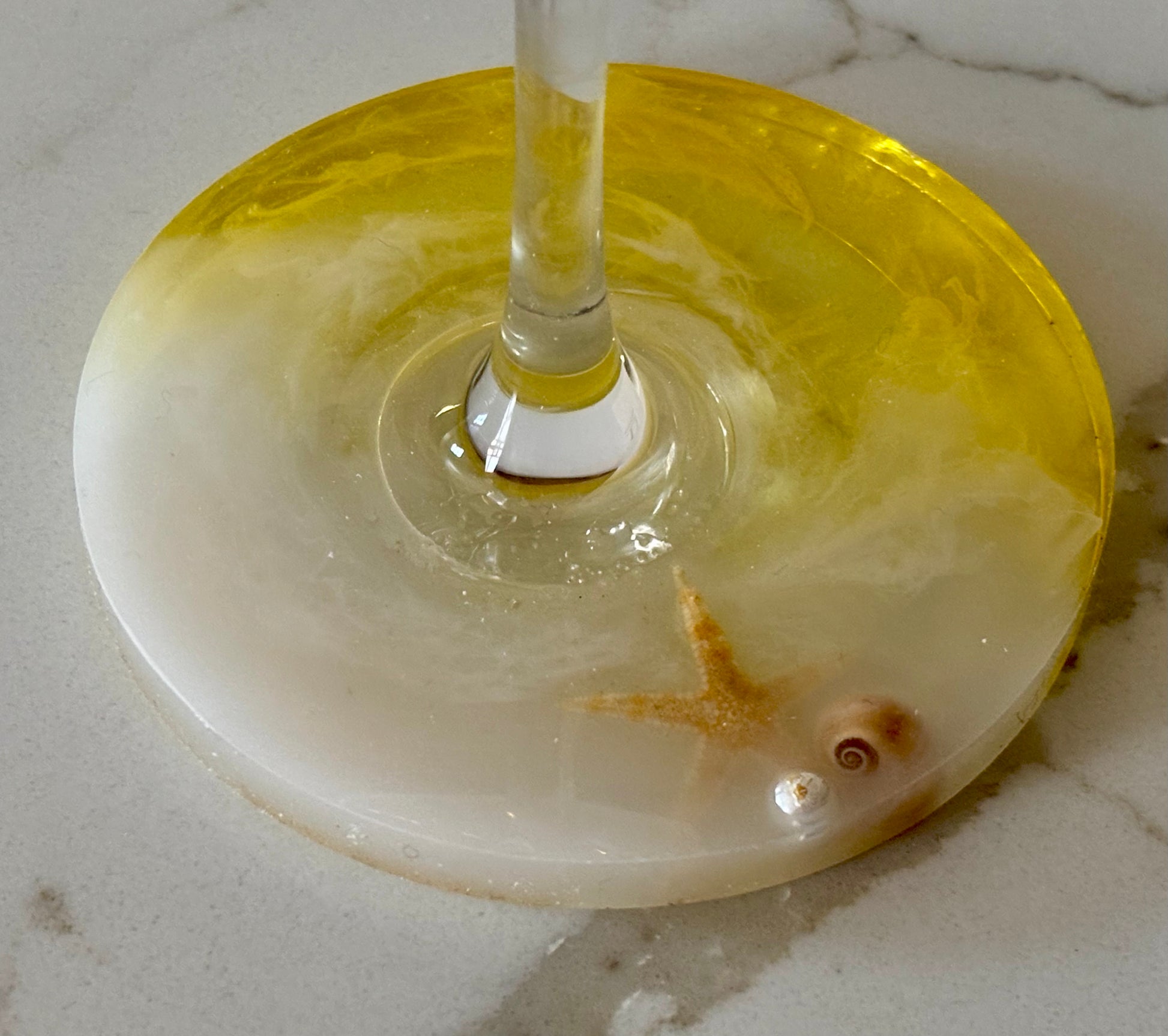 Hand-poured base with embedded shell, pearl, and starfish